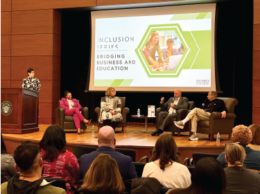 panel of people on a stage